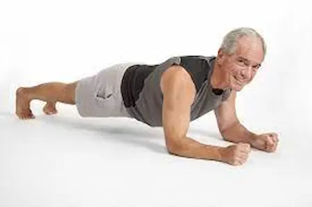 Old man doing forearm plank
